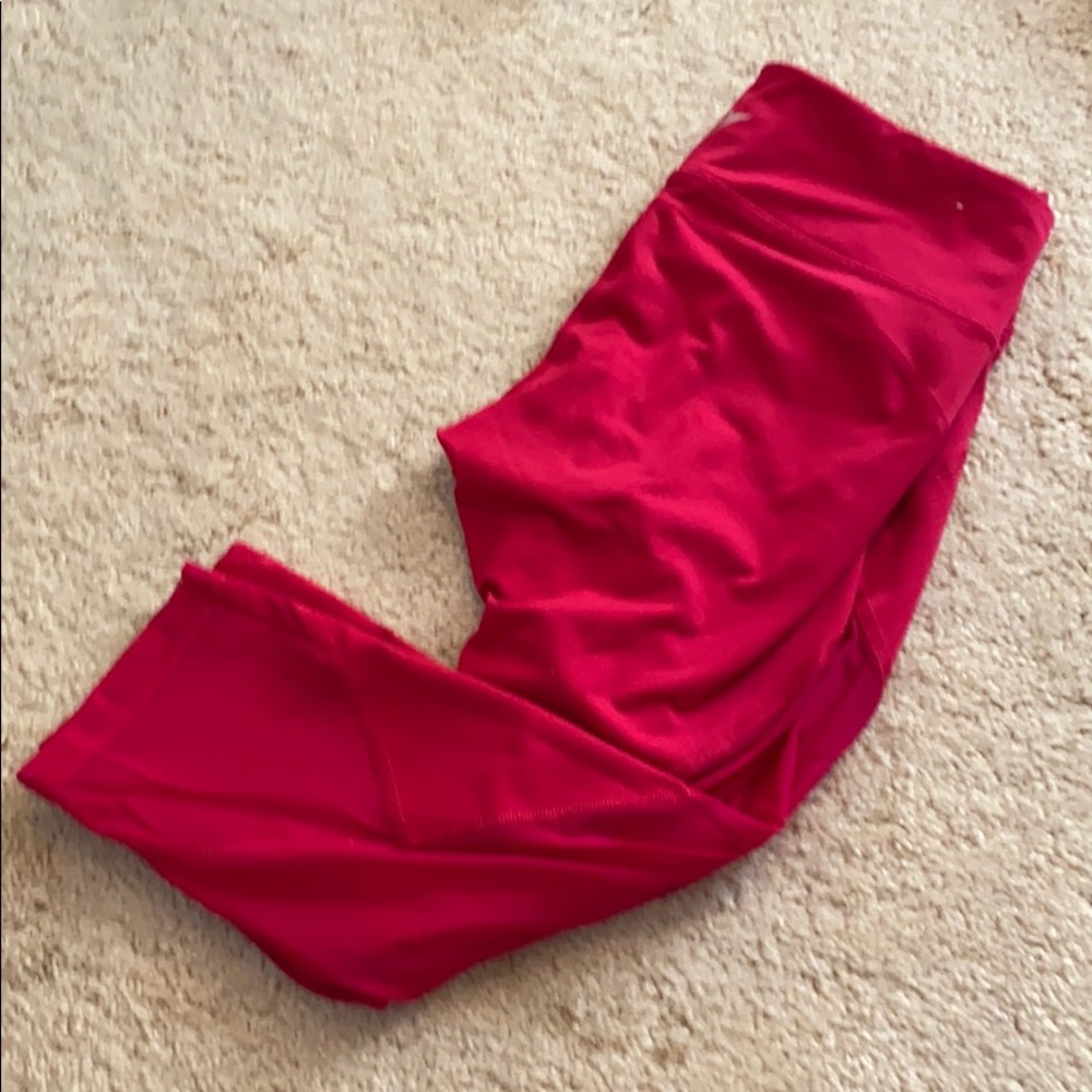 Pink athletic leggings with mesh details